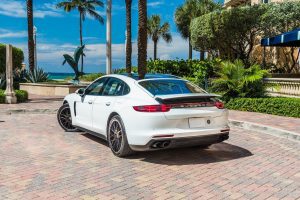 white porsche panamera rear left view