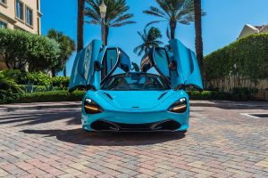 turquoise blue mclaren 720s front view doors up