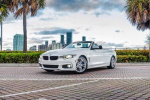 front view white bmw 440i for rent in Miami beach