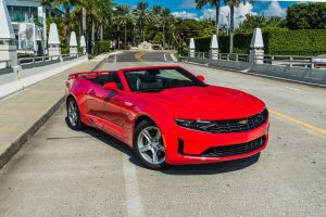 image of red chevy camaro being rented on Miami Beach