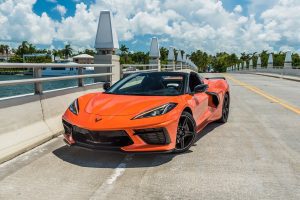 front view of orange corvette c8 rental in Miami