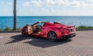 red corvette c8 left side view doors open