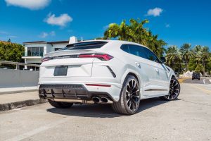 rear view of white Lamborghini Urus being rented in Miami