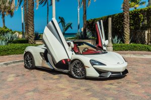 white Mclaren 570s side view doors up