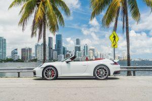 white porsche 911 carrera s (992) side view top off