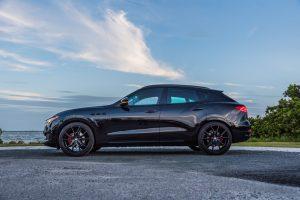 black maserati levante side view
