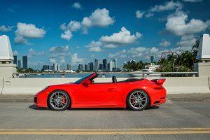 red porsche 911 carrera s (991) side view