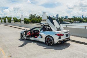 image of back side of silver corvette c8 being rented in Miami Beach by Rent & Paradise Exotic & luxury Car rental