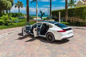 white porsche panamera 4s side view doors open