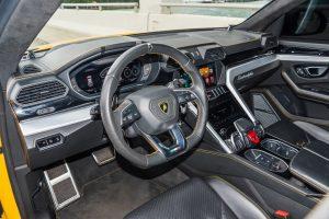 yellow lamborghini urus driver seat