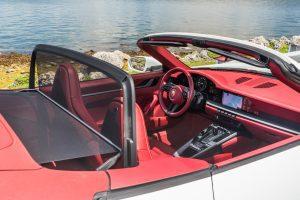 white porsche 911 carrera s (992) red interior passenger seat