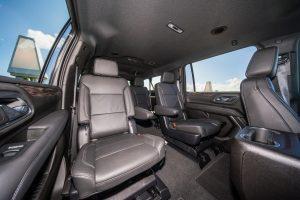 white chevy suburban black leather interior back seat left view