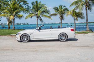 white bmw m4 side view