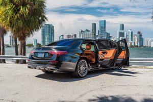 black mercedes benz s580 sedan side view doors open