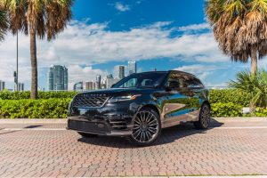 Image of front left side of black Range Rover velar rental in Lincoln Road, Miami Beach by Rent & Paradise Exotic & Luxury Car Rental.