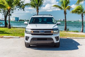 Ford Expedition rental with Miami Beach skyline in the background