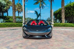 Image of front side of grey Mclaren 570s rental in Miami Beach by Rent & Paradise Exotic & Luxury Car Rental.
