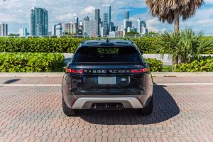 Image of back side of black Range Rover velar rental in Lincoln Road, Miami Beach by Rent & Paradise Exotic & Luxury Car Rental.