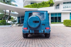 Image of back of blue Mercedes Benz G63 AMG rental in Miami Beach by Rent & Paradise Exotic & Luxury Car Rental.