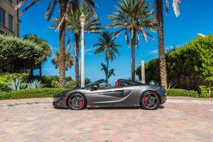Image of left side of grey Mclaren 570s rental in Miami Beach by Rent & Paradise Exotic & Luxury Car Rental.