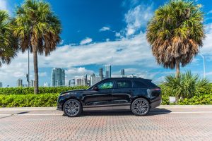 Image of left side of black Range Rover velar rental in Lincoln Road, Miami Beach by Rent & Paradise Exotic & Luxury Car Rental.