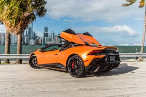 left side of Lamborghini Huracan EVO Orange thats available for rent in Miami Beach by Rent & Paradise Exotic & Luxury Car Rental