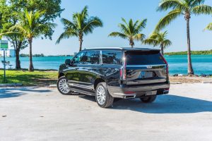 back side view of Cadillac Escalade in parking lot on Miami Beach